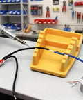 Wire Soldering Holder With Heat Resistant Silicone Stand And Five V Shaped Grooves Plus Storage Tray And Helping Hands For Welding Fixtures Designed For 32AWG To 7AWG Wires Yellow in workshop setting