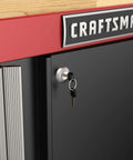 Close-up of locking system on Heavy Duty Metal Garage Storage Cabinet With Two Doors Base Unit, 1 Inch Butcher Block Work Surface.