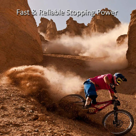 Mountain biker drifting on sandy terrain using Two Pairs Bike Disc Brake Pads For Shimano Deore Tektro for smooth braking.