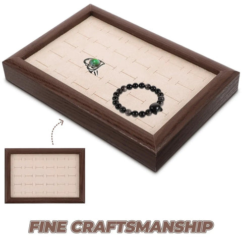 Solid Wood Earring Organizer And Ring Keeper Tray With Thirty Open Slots For Stashing Bracelets And Chains In A Rich Walnut Finish, showing black bracelet and green stone.