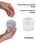 Person holding Clear Museum Gel Adhesive For Securing Collectibles And Decor Removable And Reusable Non Toxic Formula 4 oz container