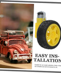 Close-up of electric motor and plastic tire wheel set for RC cars and trucks, easy assembly with axles, in hobby kit display.