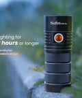 Ultra Bright SP36 Pro Flashlight With 8000 Lumens on outdoor surface with lighting specs displayed