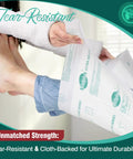 Heavy Duty Disposable Bed Pads 100 Count 30x36 Inch Ultra Absorbent Cloth Backed Incontinence Underpads in use, highlighting tear resistance.
