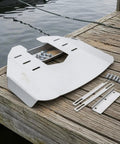 Outboard Hydrofoil Plate With Folded Wing For Stable Slick Aerodynamic Performance On 40 To 350 HP Motors and hardware on dock