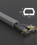 Heavy Duty PVC Floor Cable Cover To Kick Trip Hazards To The Curb Low Profile Gray Trapezoid Wire Raceway with cords inside.