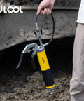 Heavy Duty 8000 PSI Pistol Grip Grease Gun Kit with 14 oz Capacity and 18 Inch Resin Flex Hose held by hand outdoors