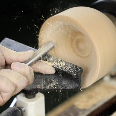 Heavy Hitter M2 HSS Bowl Gouge cutting wood on lathe, 230mm blade, creating smooth finishes for woodworking.