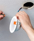 Installing Lawsen Spring Clips Recessed Lighting 200pcs Spring Clips for Downlights LED Strip Lights with screwdriver and ceiling fixture.