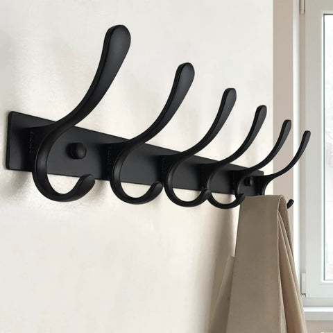 Wall Mounted Coat Rack With Six Heavy Duty Hooks Stainless Steel Metal Hanger Sturdy Coat Rack For Coats Jackets Hats Bags Space Saving Black Finish For Small Spaces In Any Room shown mounted on a wall with beige coat hanging.