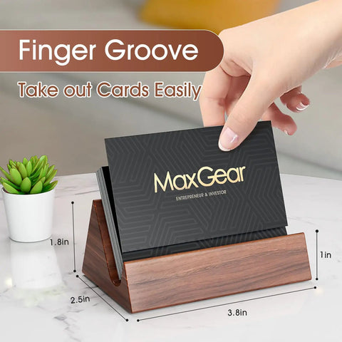 Hand placing card in Walnut Wood Card Holder And Desk Organizer For Storing And Displaying Cards, Sleek Mountain Style Card Stand With Non Slip Base For A Neat Pro Office Desk Setup.