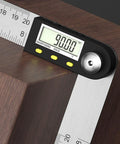 Hardcore Stainless Steel Digital Protractor With Bold Lcd Screen For Spot On 360 Degree Angle Measuring In Construction And Woodworking Gonna Help You Nail Every Cut Perfectly on wooden surface measuring 90 degrees.