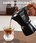 Stovetop Espresso Maker With Double Valve Tech Italian Moka Pot brewed fresh pouring espresso into glass with ice.