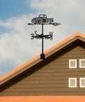 Black Metal Pickup Truck Weathervane Ornament installed on rooftop showing wind direction in outdoor setting.