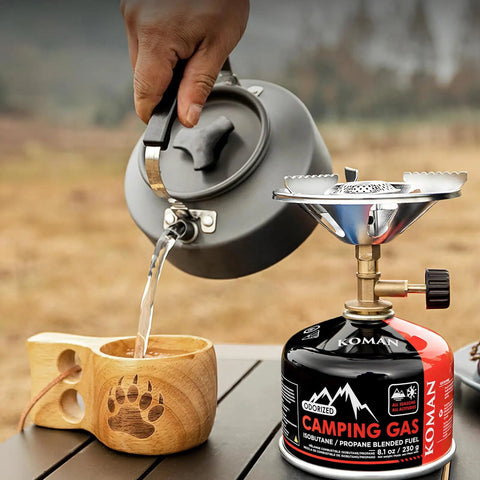 Isobutane Camping Stove Fuel Canister 230 Gram Butane Propane Blend Fuel with kettle pouring water in wooden cup