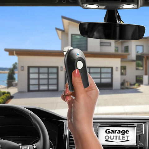 Person holding Garage Door Remote Intellicode ACSCTG Type 1 For Genie Openers From 1998 To Present with visor clip in car.