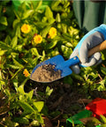 Child using Kids Metal Garden Tool Set For Little Green Thumbs With Real Shovel on plants