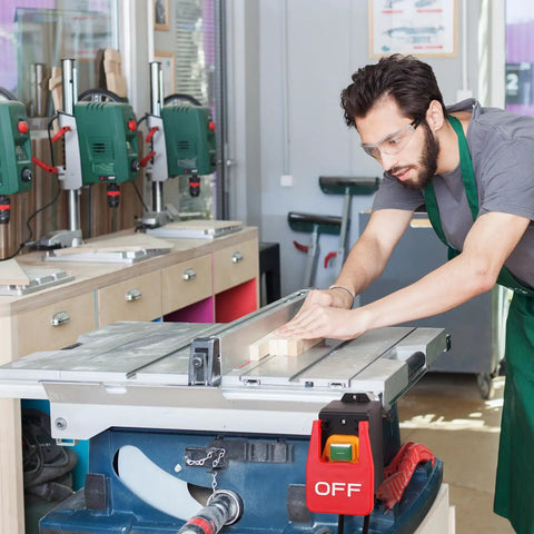 Heavy Duty Paddle Switch For Table Saw 110V To 120V Single Phase On Off Emergency Stop Paddle For Safe Hands Free Operation Fits Table Saw Router Table Drill Press With Beefy Extension Cord, installed on table saw, worker using saw.