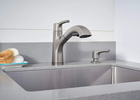 Parkwood Single Handle Pullout Kitchen Faucet With Dual Sprayer Aerated Stream Or Spray Stainless Finish ADA Compliant 120 Degree Swivel Spout Fits Single Hole Install Optional Deck Plate RP100681SS installed on grey countertop