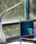 LED Desk Lamp With Ultra Quiet Bladeless Fan, Dimmable Gooseneck, Touch Control on office desk near window