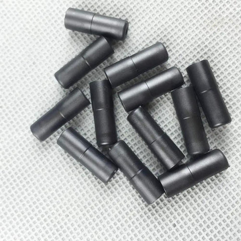 Bike Cable Ferrule End Caps Set For 5mm Brake Cables And 4mm Shift Cables arranged on textured surface