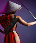 Person holding sword with Two Piece Black Katana Sword Bag Kit With Back Strap And Waistband, Ninja Carry Case visible on back.