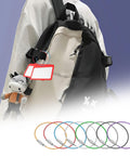Backpack with colorful loop from 50 Pack Wire Keychain Cables 12 Inch Plastic Coated 1.5mm Stainless Steel Key Ring Loops For Hanging Luggage Tags And ID Tags And Travel Accessories Silver attached to a luggage tag.