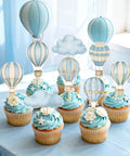 Totally Adorable Hot Air Balloon Cupcake Toppers for Baby Shower Party Decor with blue pastel balloons and clouds on cupcakes