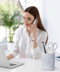 Woman using laptop with Blinged Out Desk Accessories Set Seven Piece Office Glam Kit With Diamond Tape Dispenser on desk