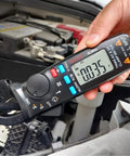 Pro Grade 1mA Resolution DC Clamp Meter True RMS Digital Multimeter measuring voltage in car engine bay
