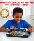 Child using Advanced Electrical Circuit Board Kit For Kids With 328 STEM Projects On Electricity, Voltage, Currents, Resistance, And Magnetism, Lights And Sounds