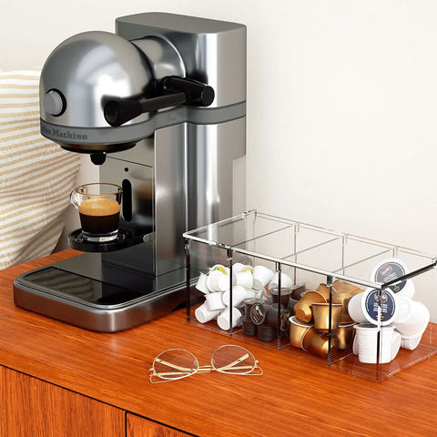Clear Acrylic 4 Compartment Coffee Capsule Holder With Lid K Cup Organizer next to espresso machine on wooden counter