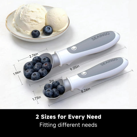 Rechargeable Heated Ice Cream Scoop With On Off Safety Lock Switch Dual Temp Warming Modes Ergonomic Handle Electric Kitchen Tool For Gelato Frozen Yogurt Sorbet And More showing two sizes, white with ergonomic handle, scoop filled with blueberries.