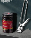 All In One Adjustable Jar And Can Opener No Fuss Stainless Steel Manual Kitchen Gadget With Jar Lid Gripper beside a glass jar