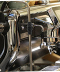 Close-up of an espresso machine with heat resistant steam wand guard sleeve, silicone protector installed on wand.