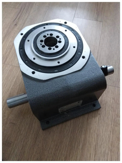 Top Shelf Rotary Actuator Cam Indexer With Hella Precise Indexing And A Smooth Quiet Ride For Heavy Duty Automation Assembly And Printing Factory Floor, view of the top with circular plate.