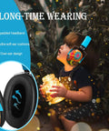 Child wearing Kids Noise Cancelling Earmuffs With 25dB NRR Adjustable Headband Fireworks Pattern, holding a jar of lights.