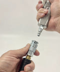 Industrial Style Air Quick Connect Plugs Nipples In Heat Treated Steel One Quarter Inch Male NPT shown connecting to air tool