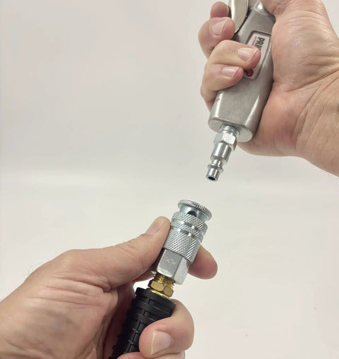 Industrial Style Air Quick Connect Plugs Nipples In Heat Treated Steel One Quarter Inch Male NPT shown connecting to air tool