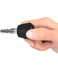 Hand holding One Key System 16 Lock Cylinders Pack Black Replacement Kit With No Fuss Easy Keyed Access For Real Security Locks 16 Core Set
