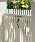 Stainless Steel Gate Hook and Eye Latch for Cabinet Door Window Shed Barn attached to a white picket fence gate.