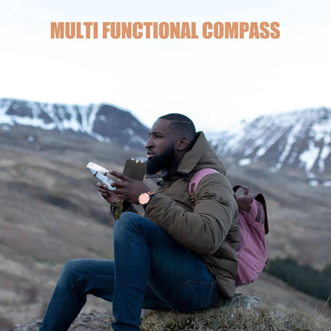 Hiker holding a Survival Compass With Scale Multifunctional Orienteering Tool Portable Hiking Compass With Mirror And Glows In The Dark Needle