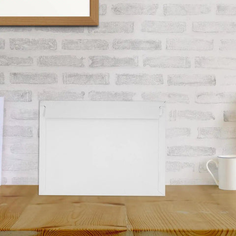 A4 Gray White Self Sealing Paper Mailing Envelopes Thickened For Documents And Photos 30 Pack on wooden table with brick background