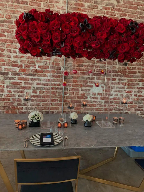 Table setting with red rose centerpiece against brick wall, showcasing Grey Soapstone Kitchen Countertop Backsplash Peel And Stick.