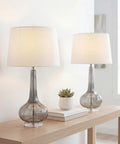 Smoke Gray Glass Teardrop LED Table Lamps Set of 2, 28.5-Inch Tall with White Linen Shade on a wooden console by window