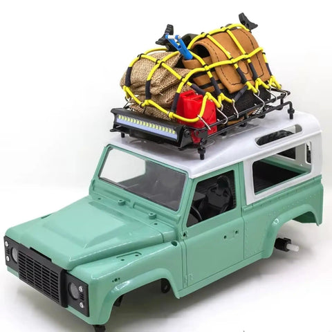 Premium 1/12 Scale Metal Luggage Carrier Roof Rack With Bright Light mounted on an RC truck, holding gear for off-road adventures.