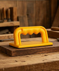 Yellow Flat Base Table Saw Push Guide Handles Jointer And Planer Duties Smooth As Silk Ergonomic Grip on wooden workbench.