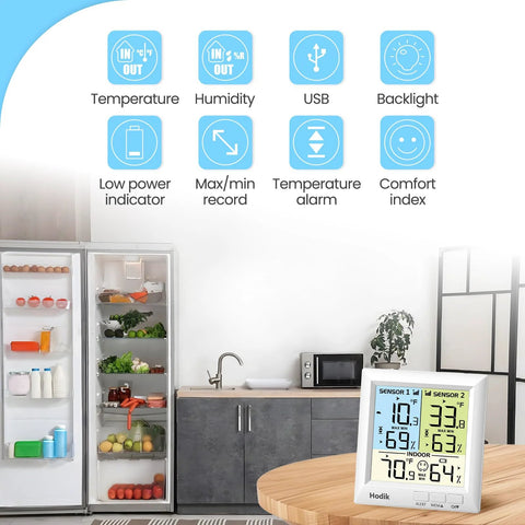 Hodik wireless freezer thermometer with alarm, front view, digital display, backlight, on kitchen table beside fridge.