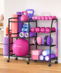 All In One Home Gym Organizer Rack with wheels and hooks, storing kettlebells, dumbbells, yoga mats, and foam rollers in living room.