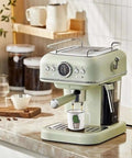 Retro-style espresso machine with a cactus print cup underneath, part of the Four Pack Ceramic Demitasse Espresso Cups set